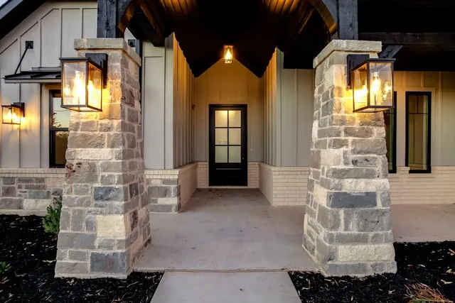 a kitchen with stainless steel appliances granite countertop a sink a stove and a wooden floors