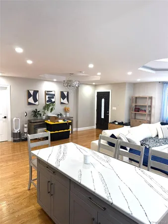 a large kitchen with a large counter top appliances and cabinets
