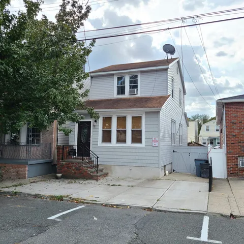 a view of a house with a street