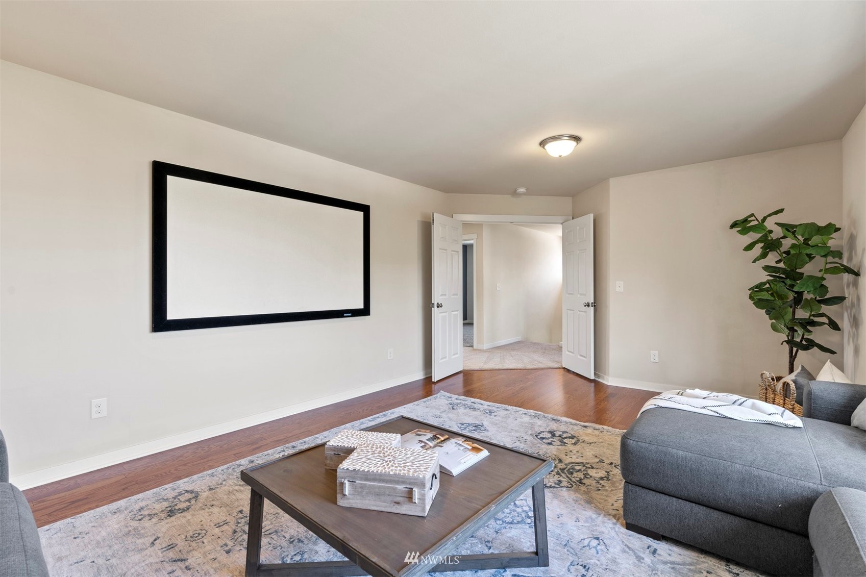 4320 230th Place Southeast Bothell, WA 98021 - Photo 17 of 31 a living room with furniture and a potted plant