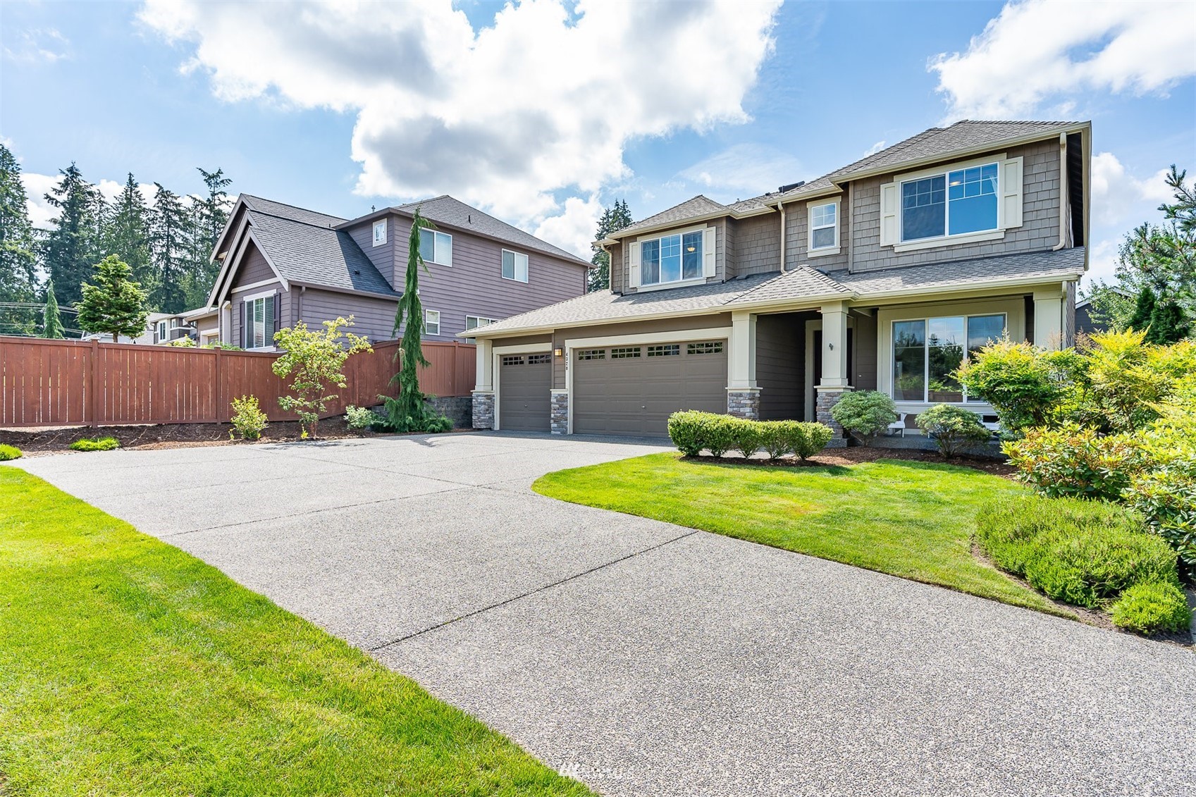 4320 230th Place Southeast Bothell, WA 98021 - Photo 2 of 31 a front view of house with yard and green space