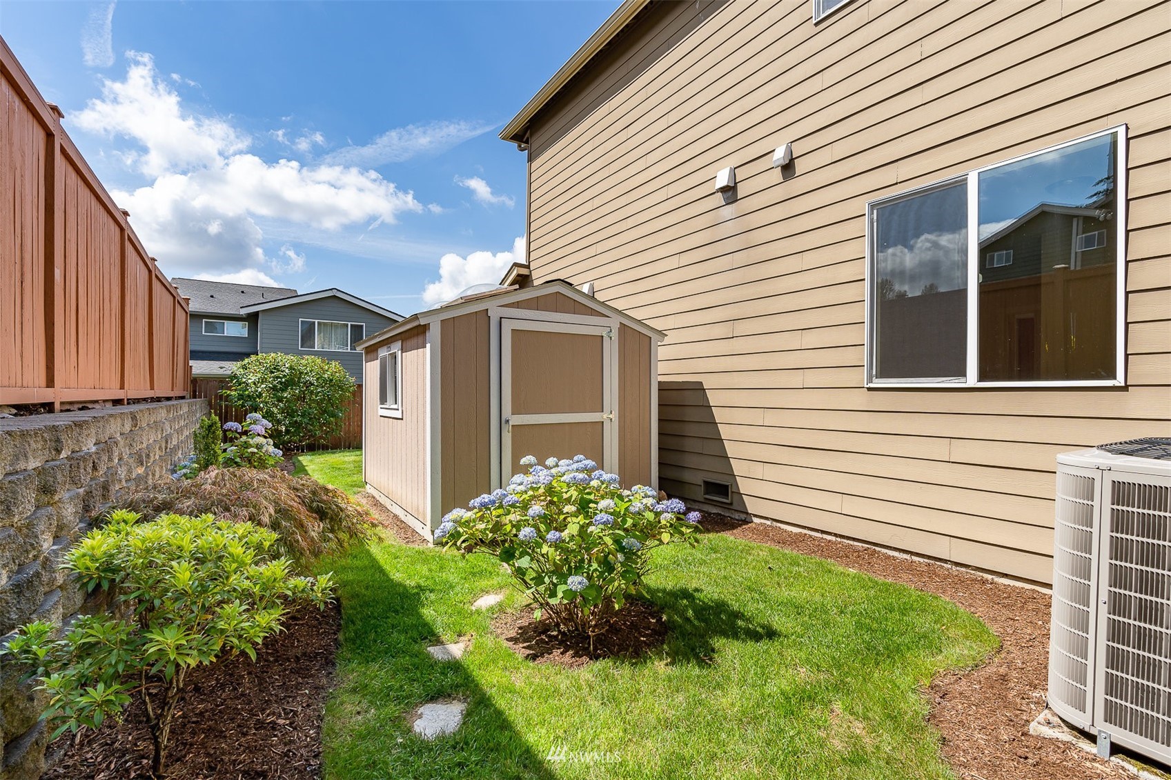 4320 230th Place Southeast Bothell, WA 98021 - Photo 30 of 31 a view of a house with a yard and potted plants