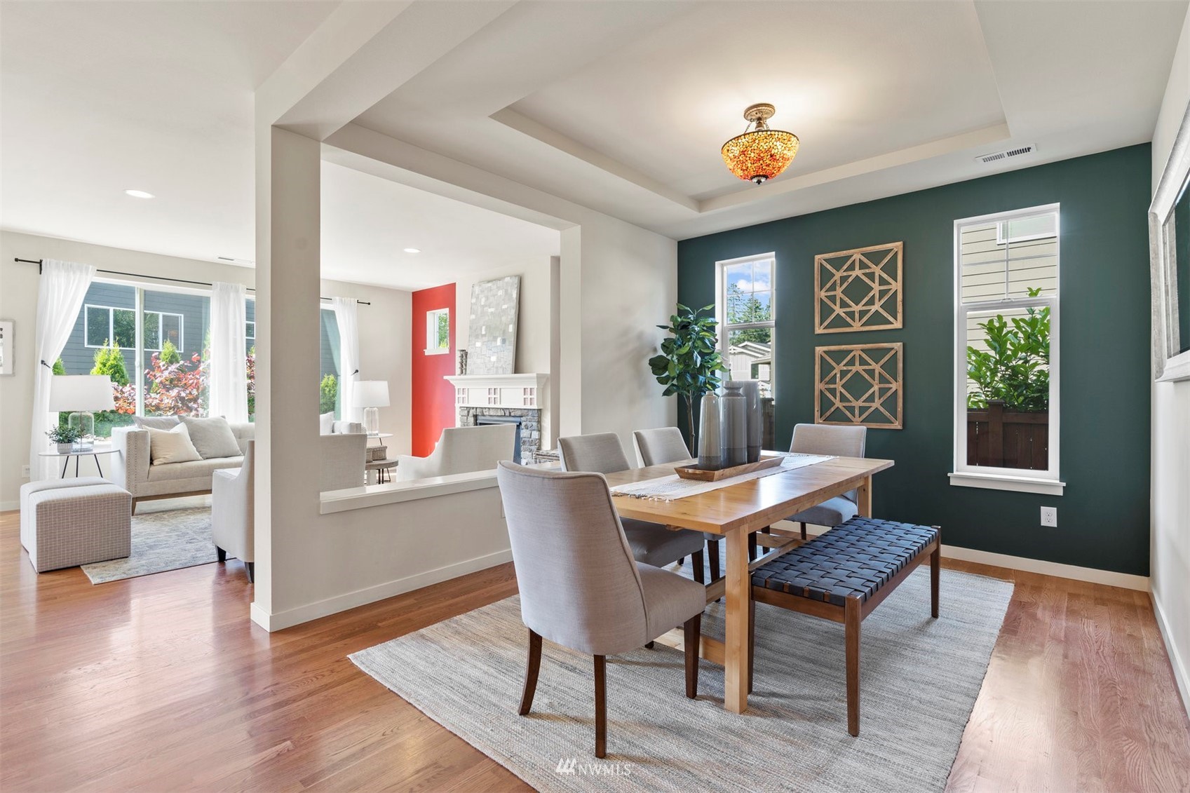4320 230th Place Southeast Bothell, WA 98021 - Photo 7 of 31 a dining room with wooden floor a glass table and chairs