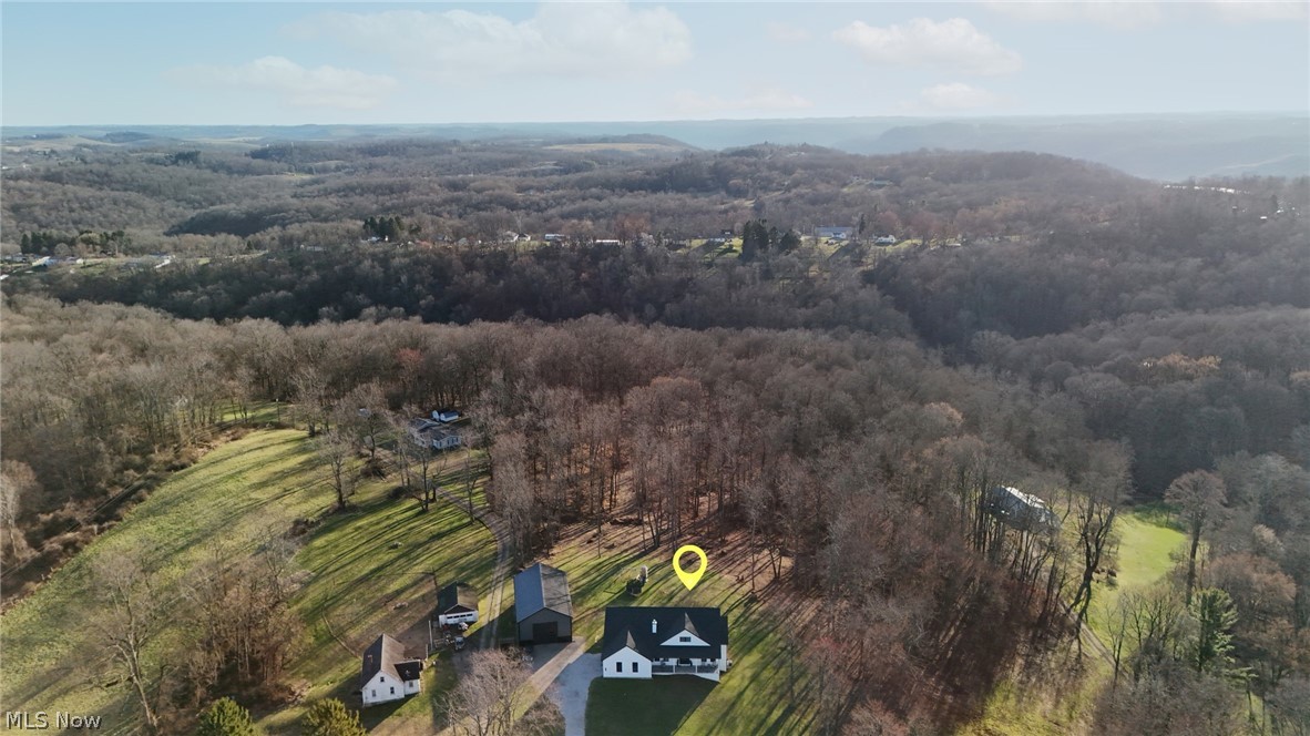 258 Friendly Acres Road Wellsburg, WV 26070 - Photo 38 of 47 Drone / aerial view of a heavily wooded area