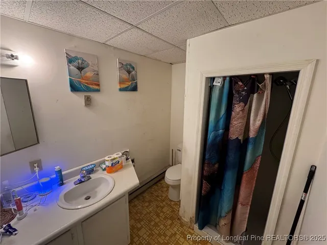 a bathroom with a sink and mirror