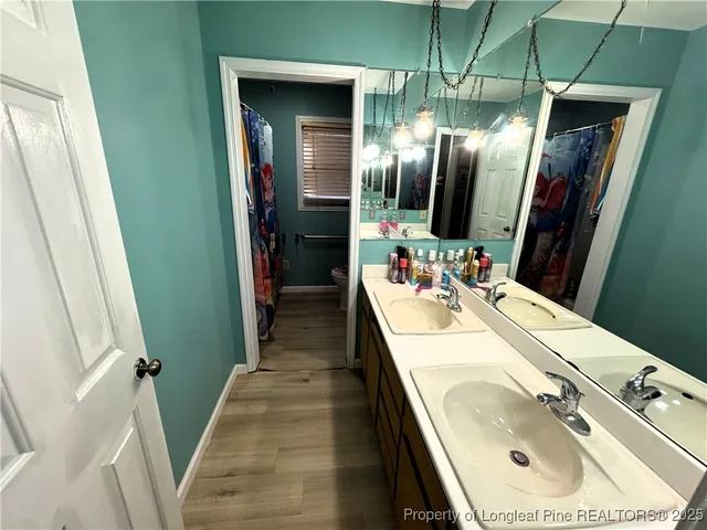 a bedroom with bed and window