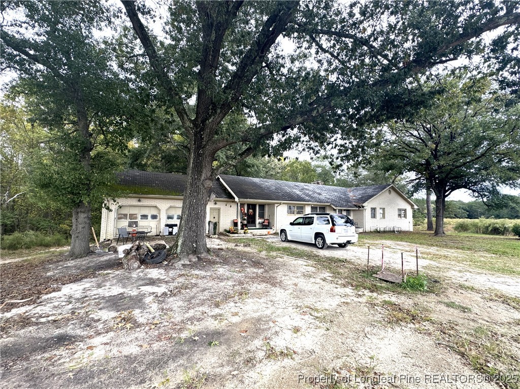 310 Old Hertford Ln Spring Lake Spring Lake, NC 28390 - Photo 2 of 30 a view of a house with a yard covered in snow