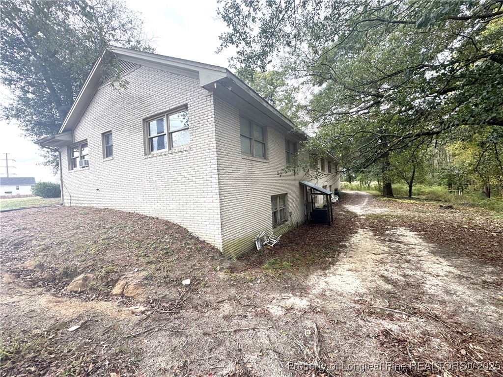 310 Old Hertford Ln Spring Lake Spring Lake, NC 28390 - Photo 26 of 28 a view of a backyard with large trees