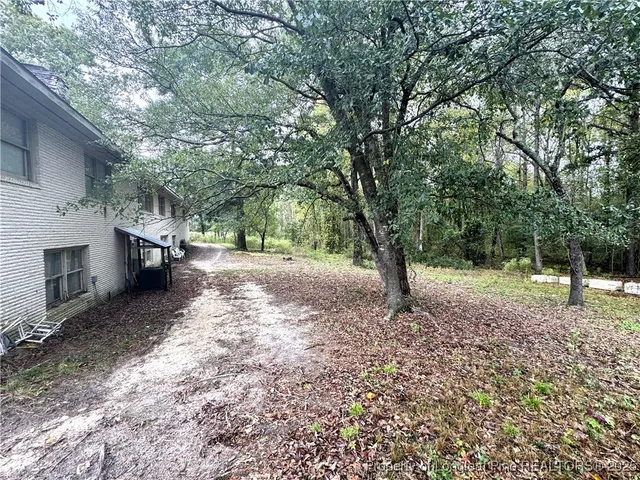 a backyard of a house with lots of green space
