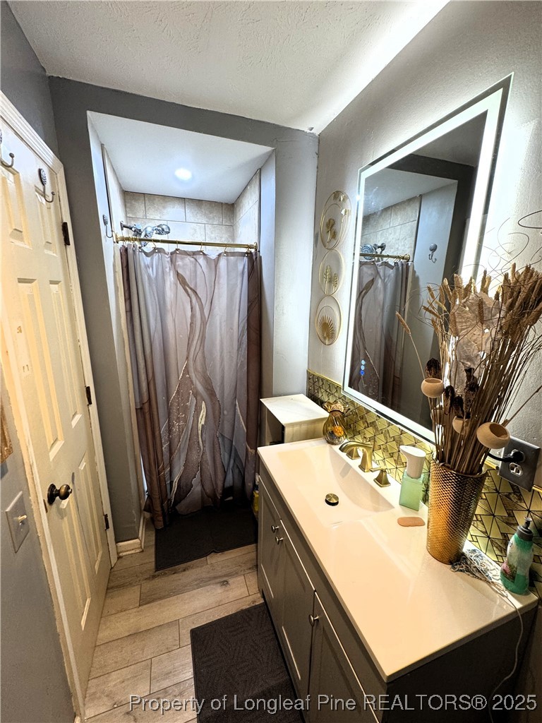 310 Old Hertford Ln Spring Lake Spring Lake, NC 28390 - Photo 8 of 28 a bathroom with a sink toilet and shower