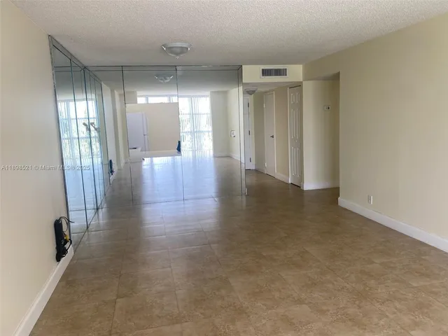 a view of hallway with livingroom