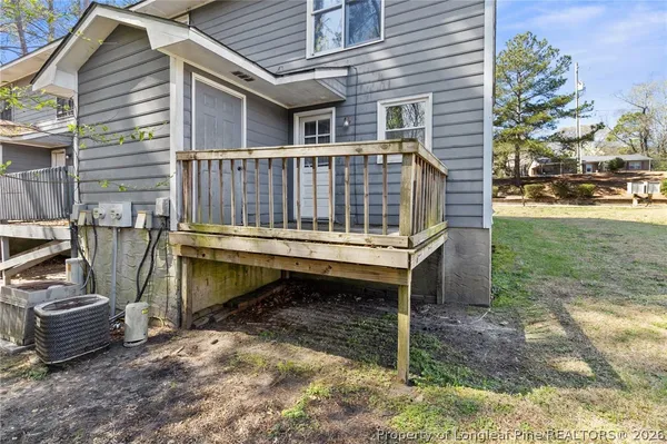 a view of a deck with a table and chairs