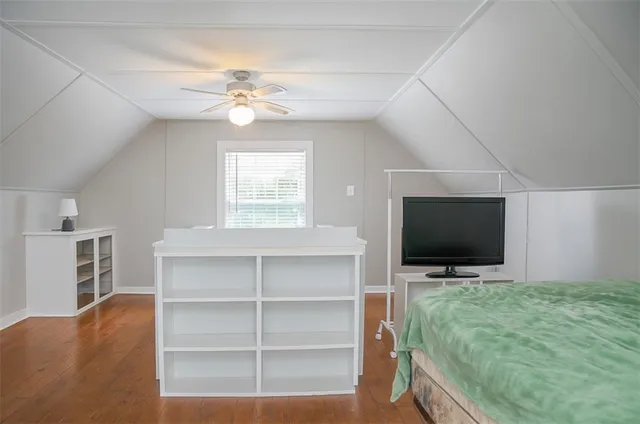 a living room with a flat screen tv and a fireplace