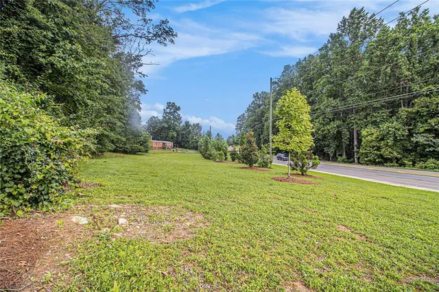 a view of a field with an trees