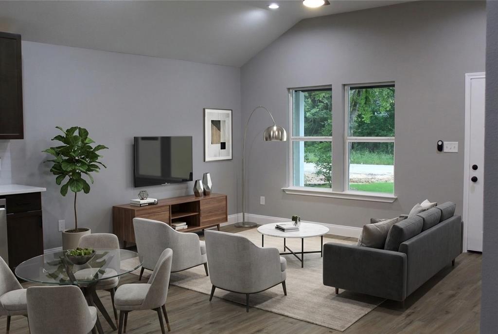 191 Geronimo Mabank, TX 75156 - Photo 2 of 12 a living room with furniture a large window and a flat screen tv
