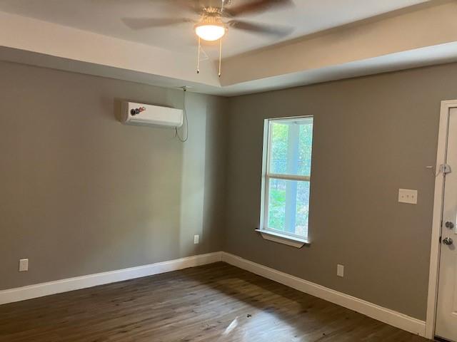 191 Geronimo Mabank, TX 75156 - Photo 10 of 12 an empty room with wooden floor and windows