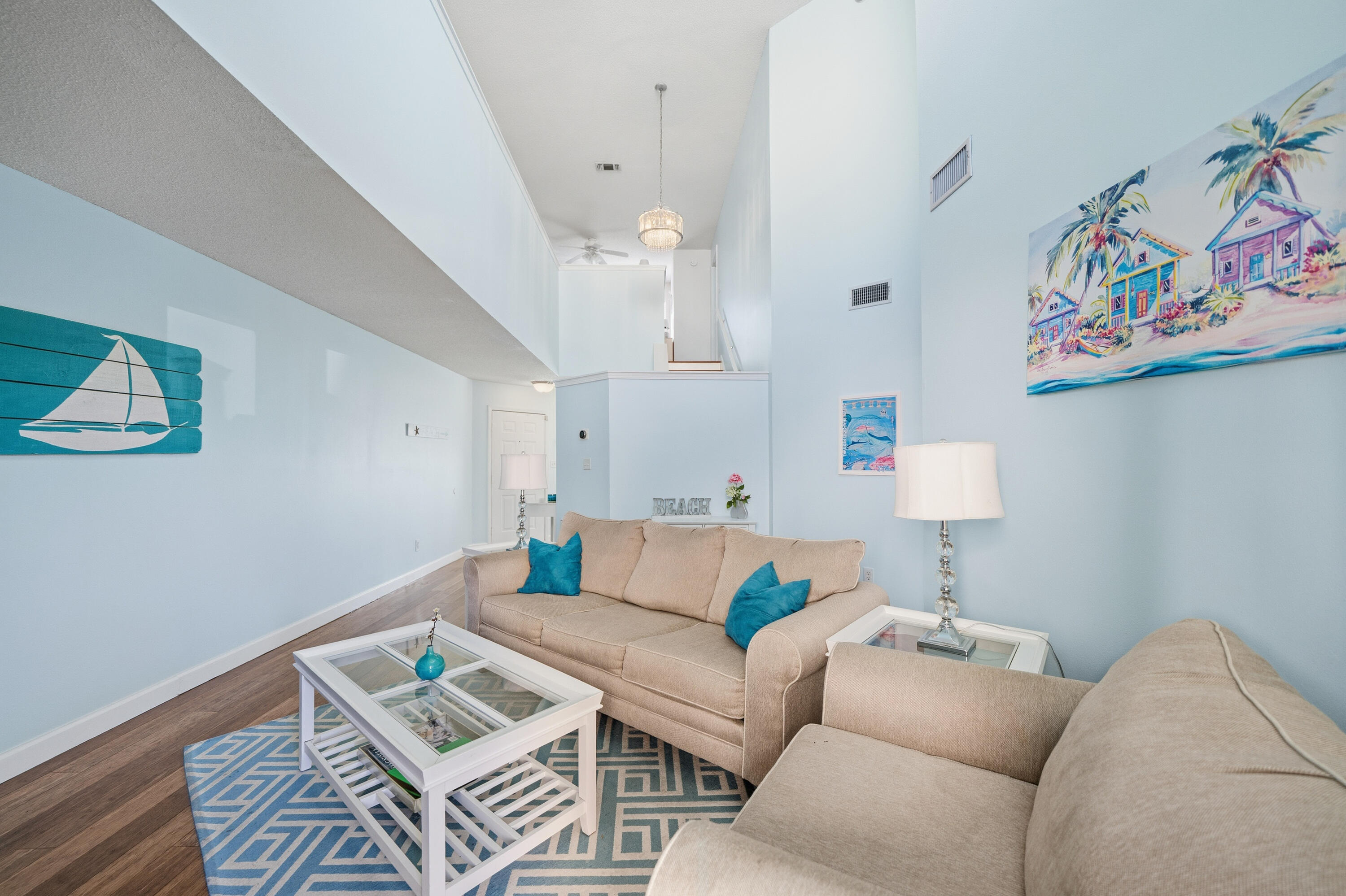 130 Durango Road, Unit 107 Destin, FL 32541 - Photo 13 of 44 a living room with furniture and painting on the wall