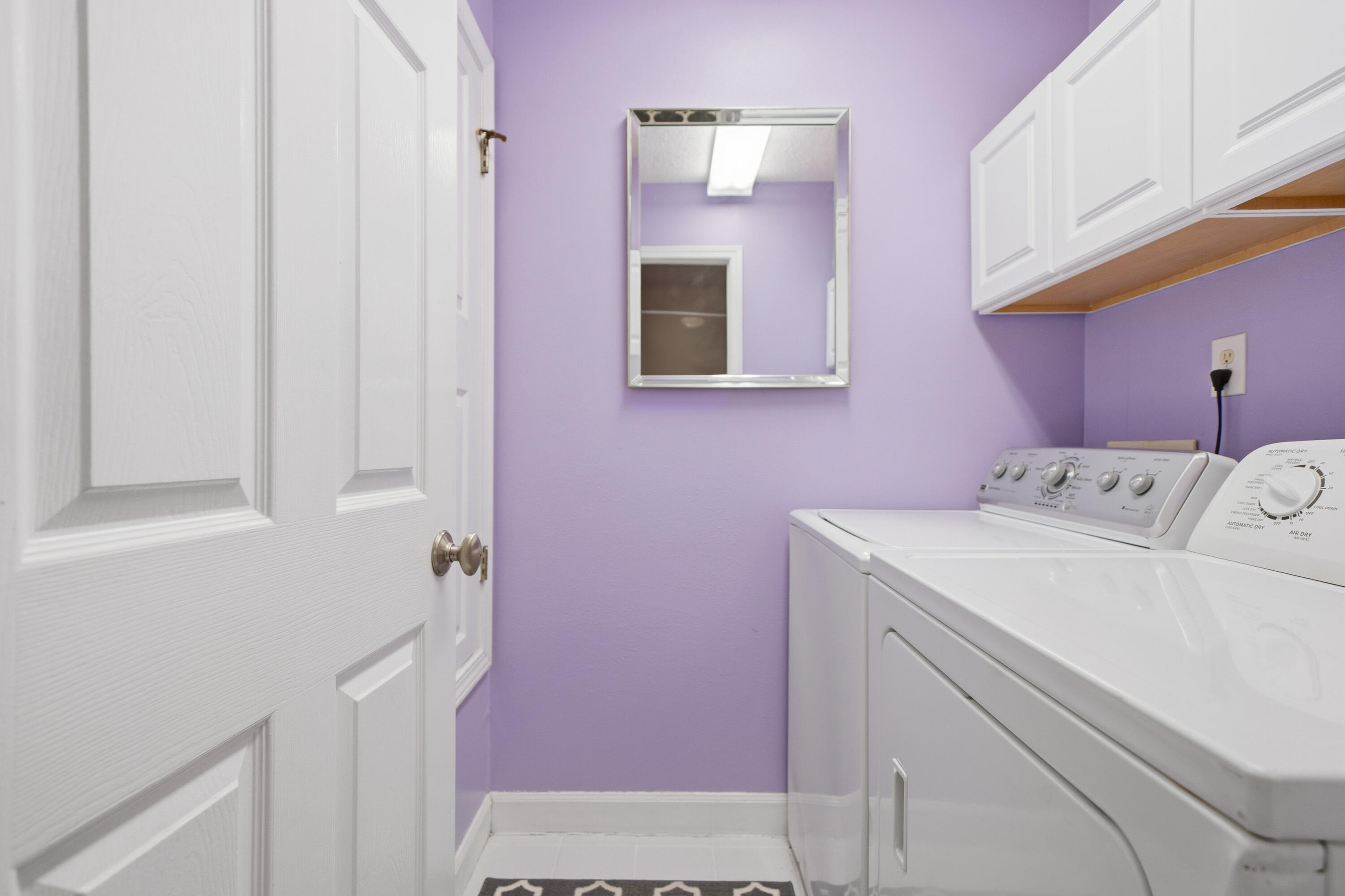 130 Durango Road, Unit 107 Destin, FL 32541 - Photo 19 of 44 a utility room with a sink dryer and washer