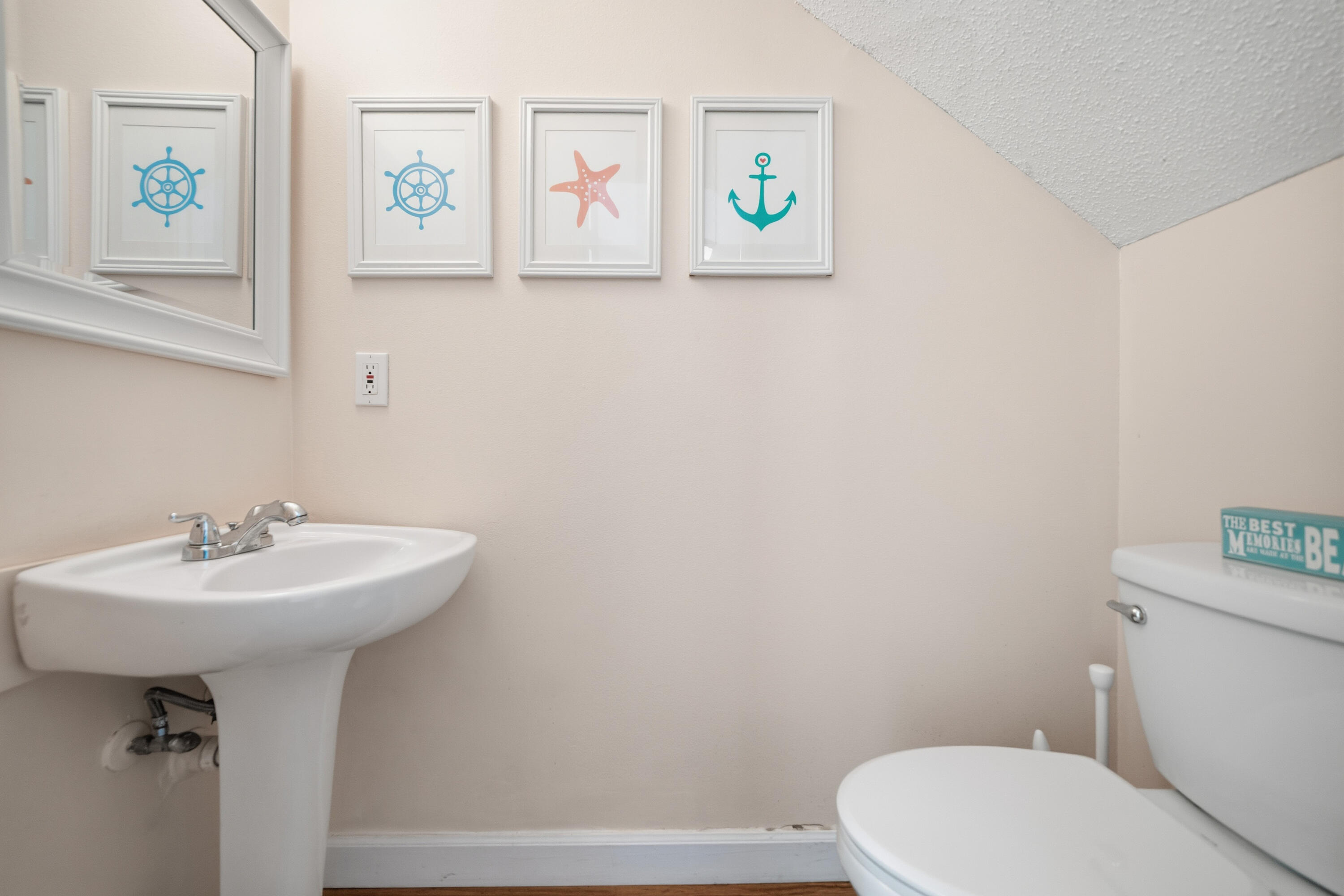 130 Durango Road, Unit 107 Destin, FL 32541 - Photo 20 of 44 a bathroom with a sink mirror and toilet