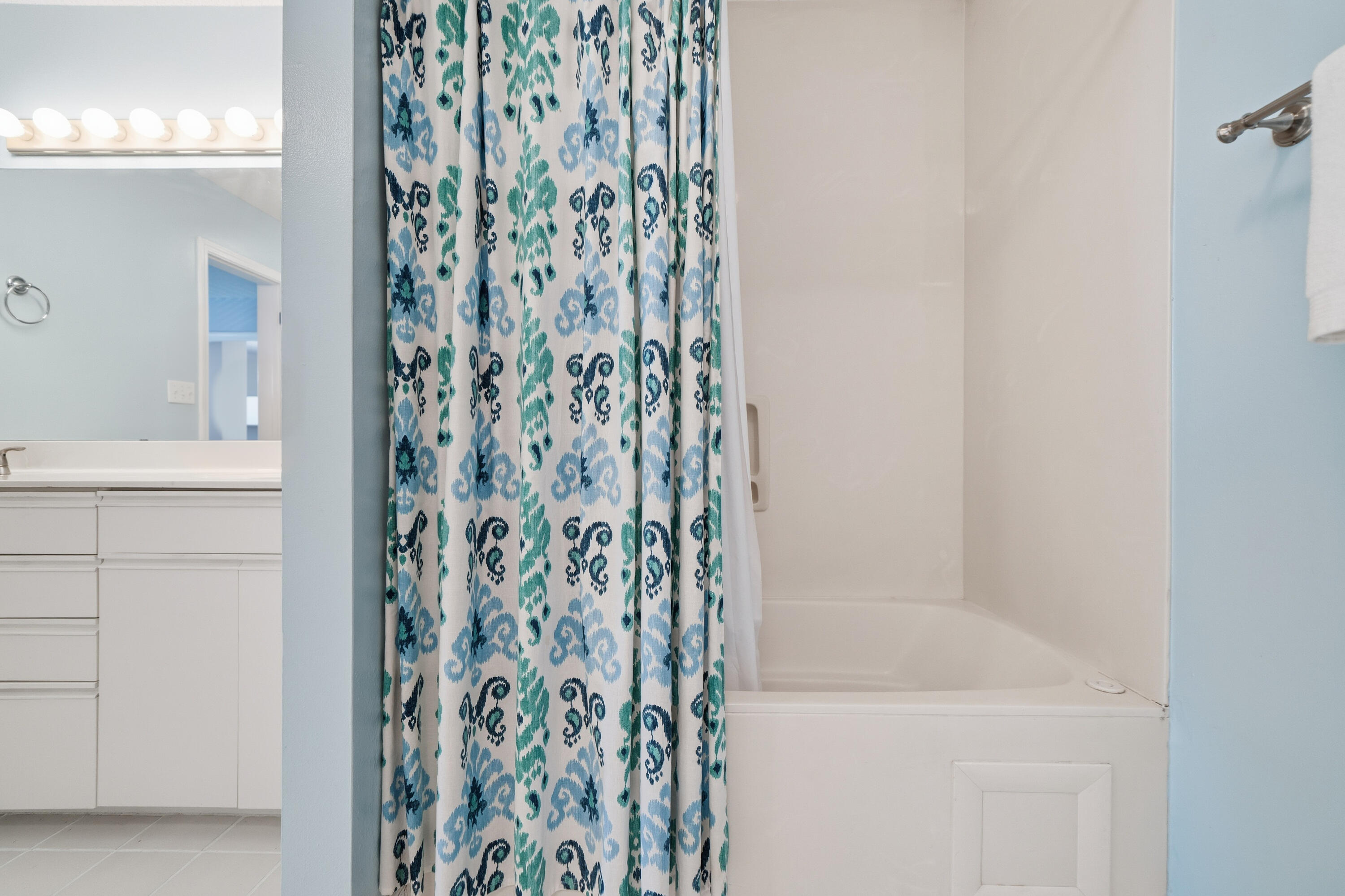 130 Durango Road, Unit 107 Destin, FL 32541 - Photo 27 of 44 a bathroom with a shower curtain and a bathtub