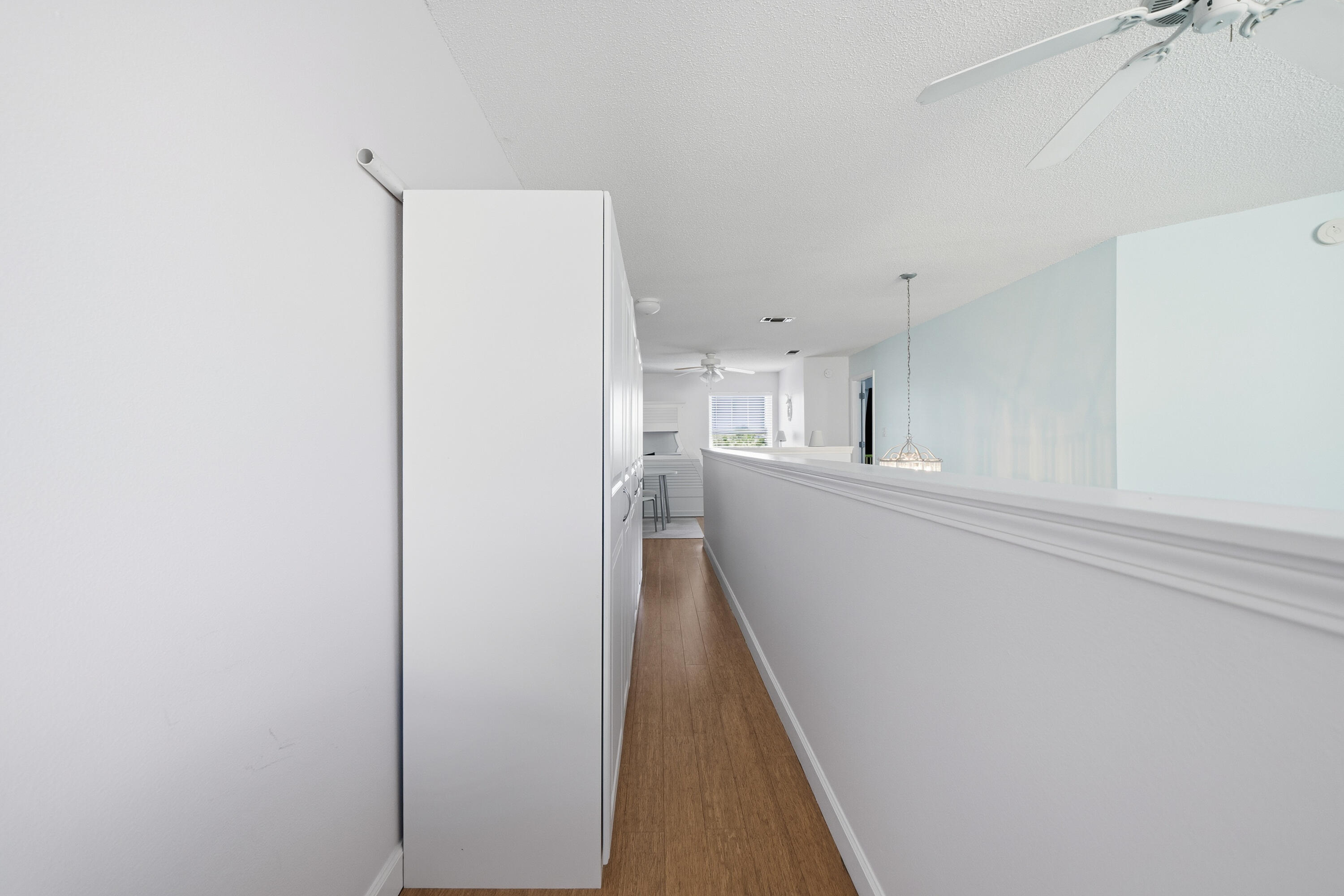 130 Durango Road, Unit 107 Destin, FL 32541 - Photo 31 of 44 a view of hallway with wooden floor