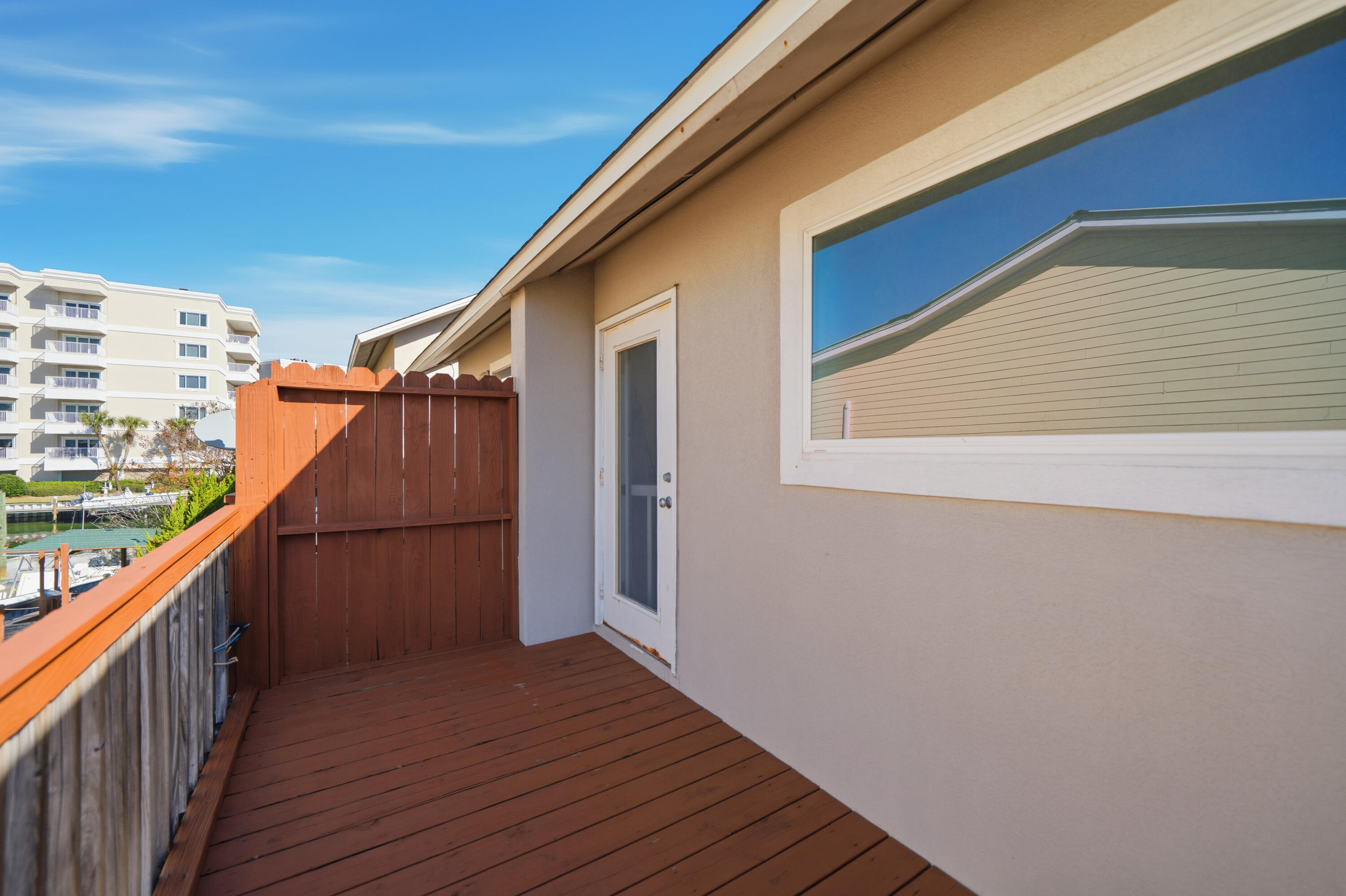 130 Durango Road, Unit 107 Destin, FL 32541 - Photo 36 of 44 a view of balcony with wooden floor
