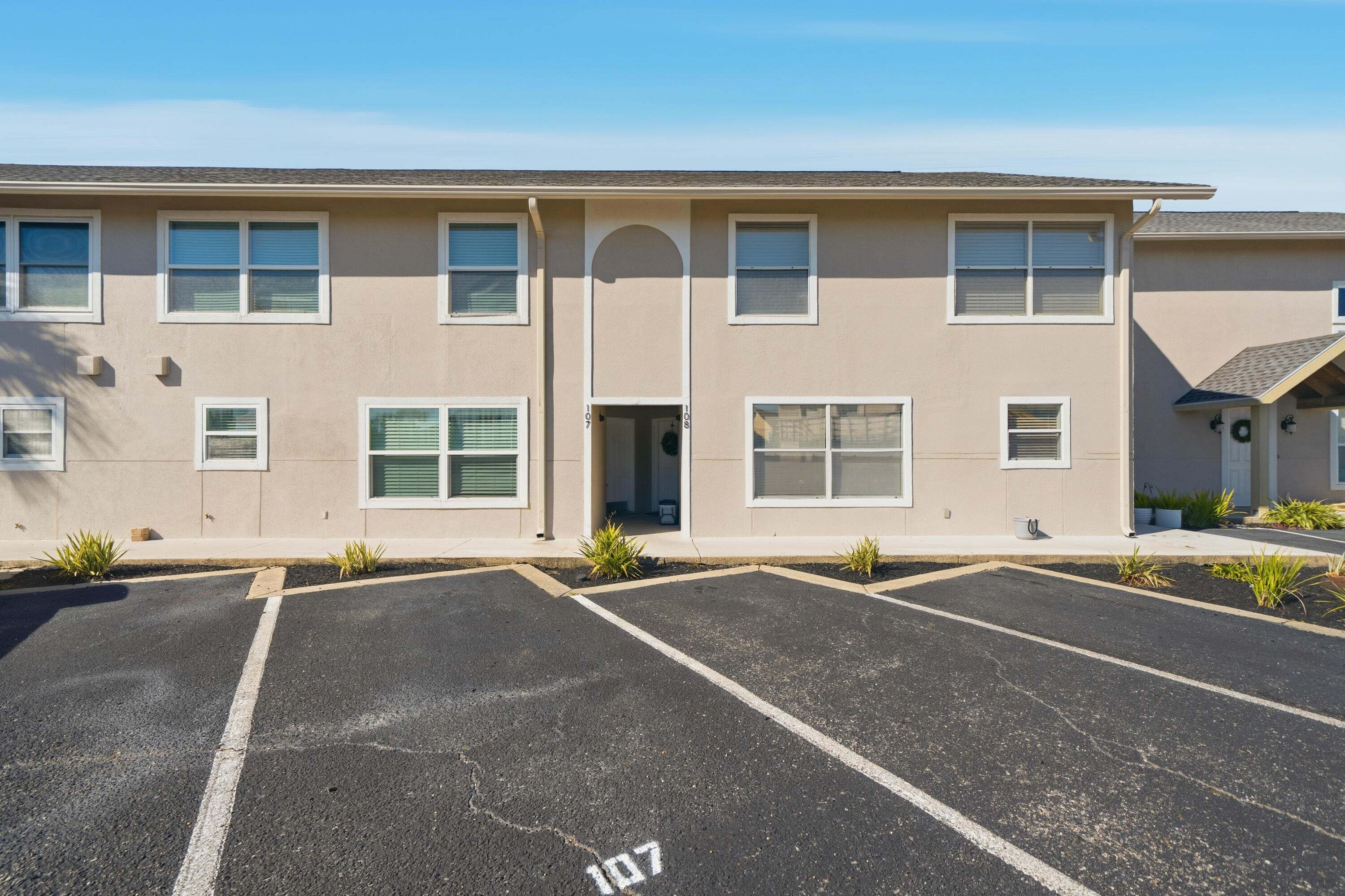 130 Durango Road, Unit 107 Destin, FL 32541 - Photo 37 of 44 a front view of a house with a road