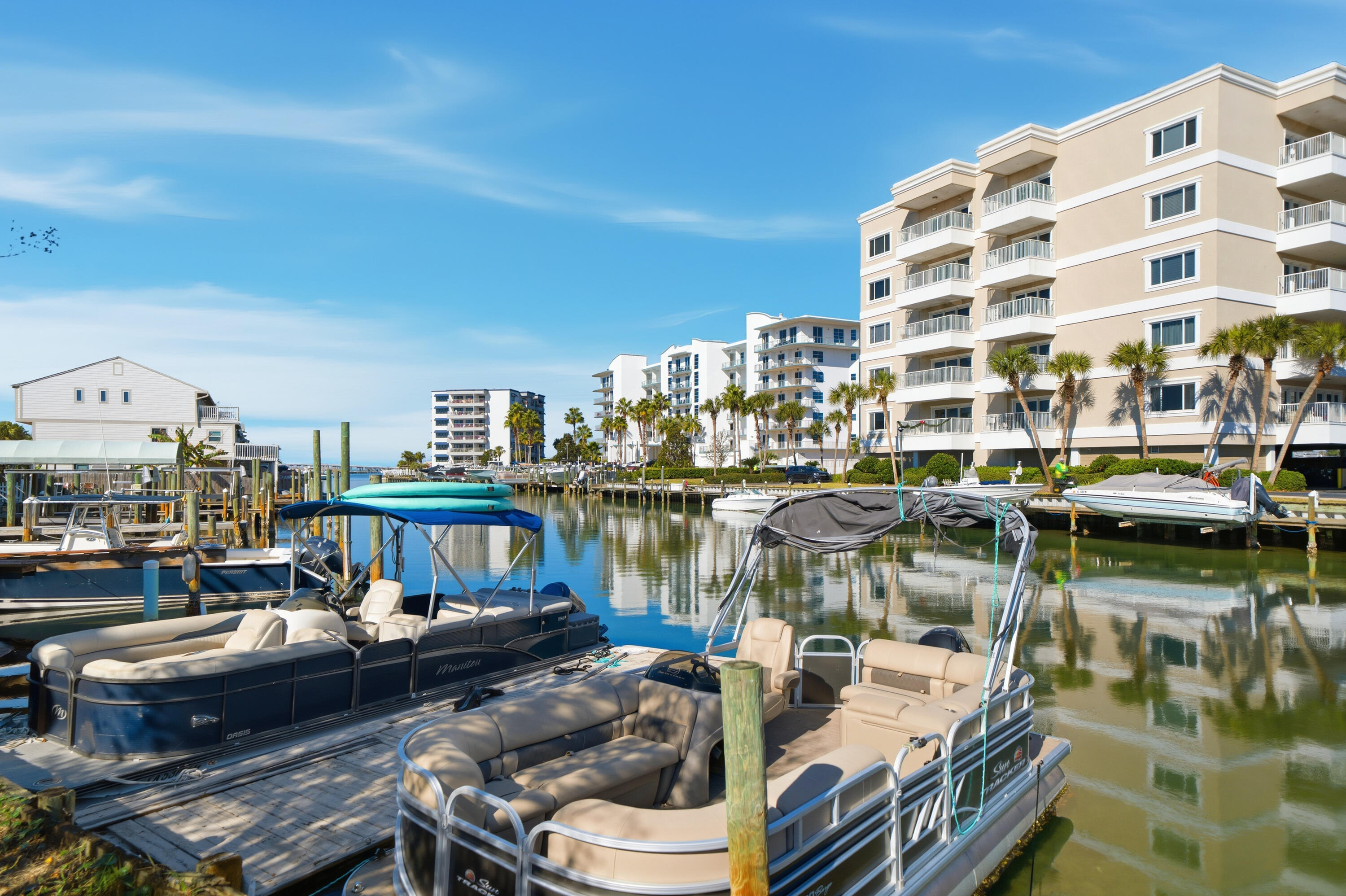 130 Durango Road, Unit 107 Destin, FL 32541 - Photo 4 of 44 a view of a lake with building and outdoor seating