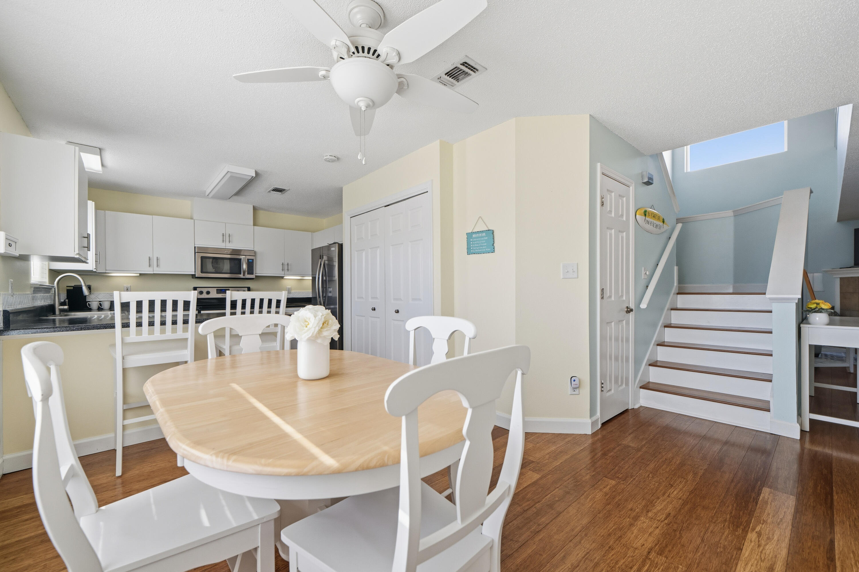 130 Durango Road, Unit 107 Destin, FL 32541 - Photo 8 of 44 a view of a dining room with furniture and wooden floor