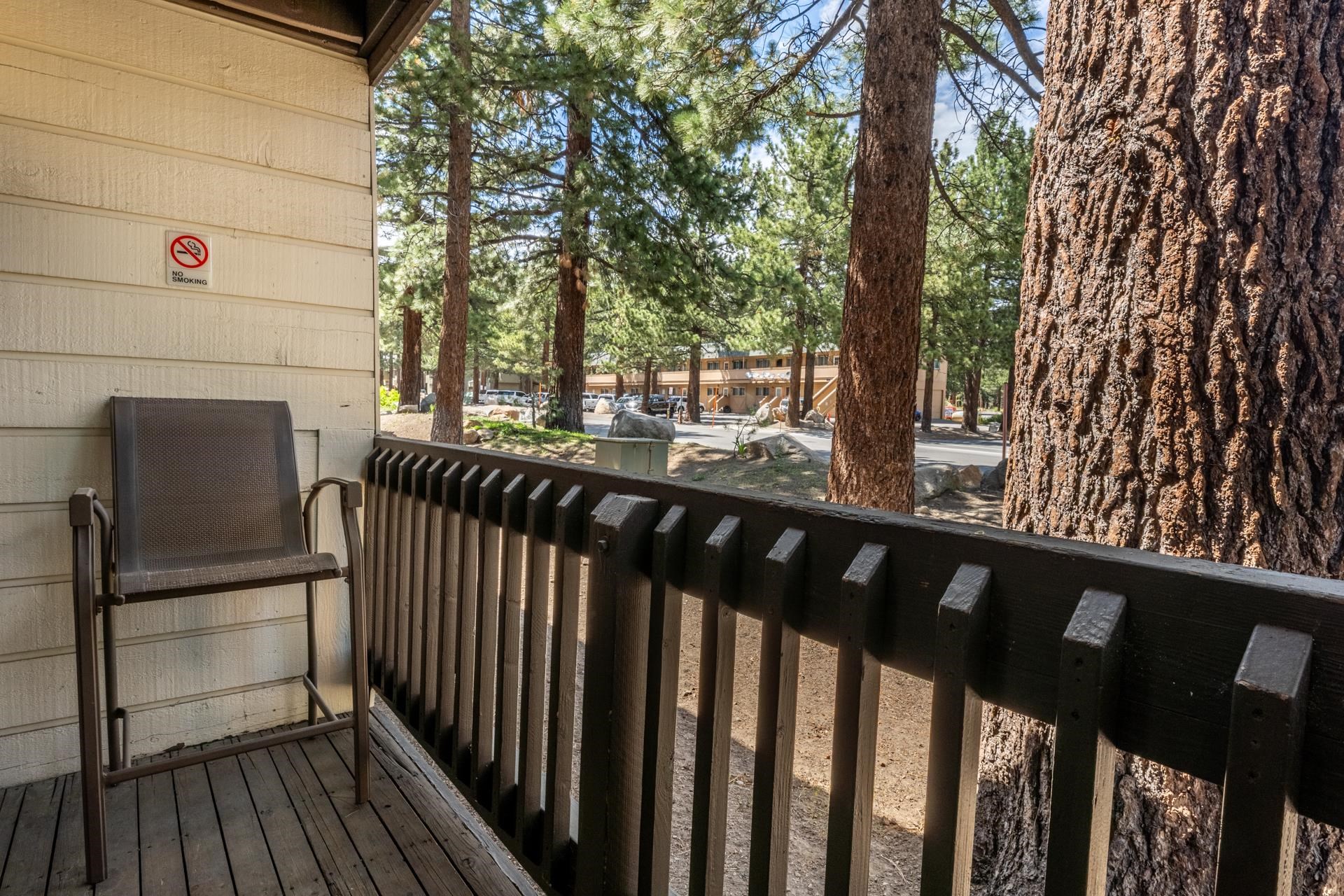 2289 Sierra Nevada Road, Unit F3 Mammoth Lakes, CA 93546 - Photo 13 of 17 a view of wooden balcony and trees