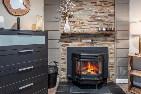 a living room with furniture and a fireplace