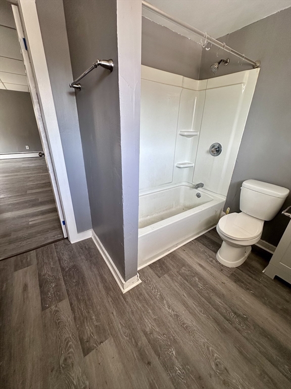 128 Mill Street Springfield, MA 01108 - Photo 4 of 14 a bathroom with a toilet a sink and a bathtub