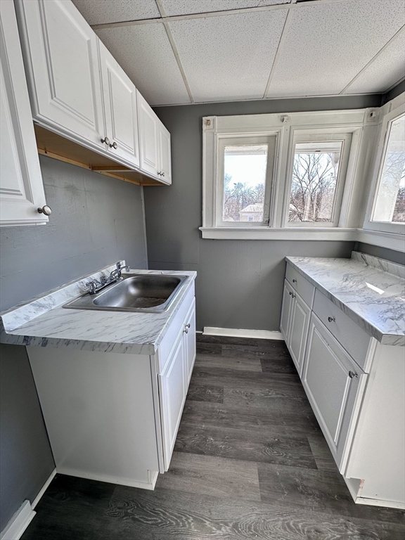 128 Mill Street Springfield, MA 01108 - Photo 6 of 14 a kitchen with granite countertop cabinets stainless steel appliances a sink and a window