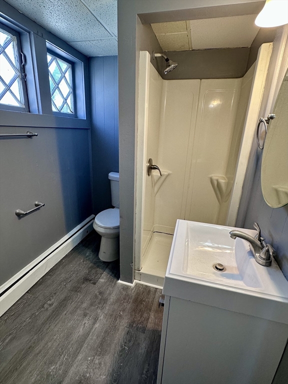 128 Mill Street Springfield, MA 01108 - Photo 8 of 14 a bathroom with a sink a toilet and shower