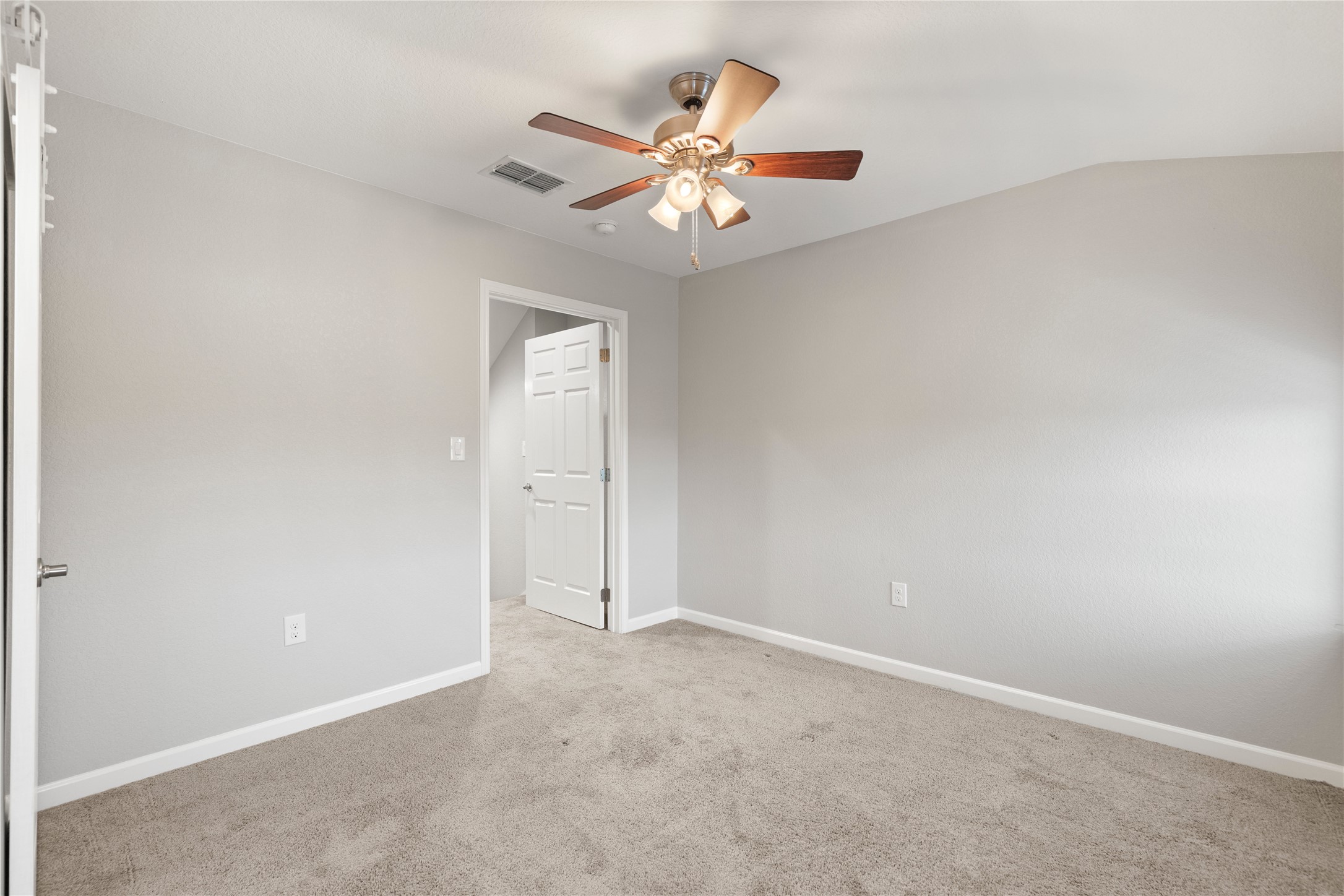 1293 Pioneer Road Seguin, TX 78155 - Photo 28 of 40 A well-lit room offering a neutral canvas and a functional ceiling fan for comfort.