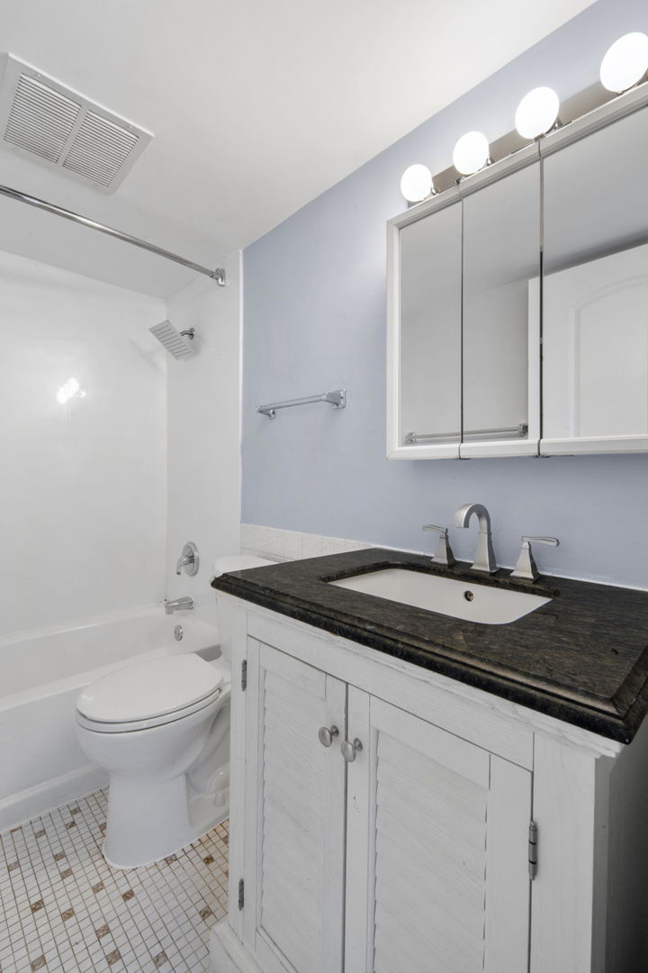 104 East Bailey Road, Unit A Naperville, IL 60565 - Photo 11 of 16 a bath room with a sink and a toilet