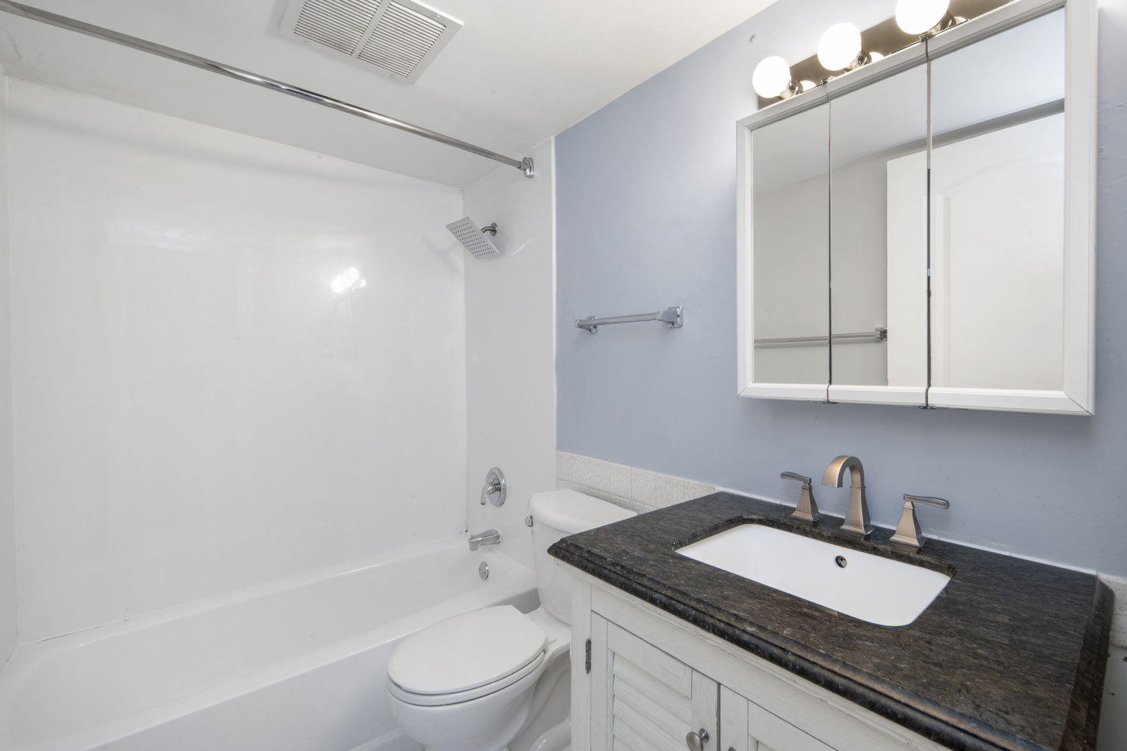 104 East Bailey Road, Unit A Naperville, IL 60565 - Photo 10 of 16 a bathroom with a granite countertop sink toilet and shower