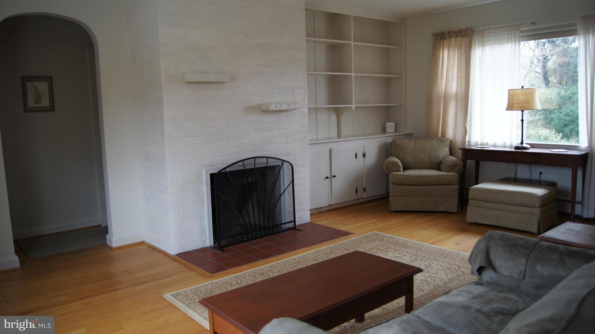 7314 Knollwood Road Baltimore, MD 21286 - Photo 6 of 30 Living Room with picture window and fireplace