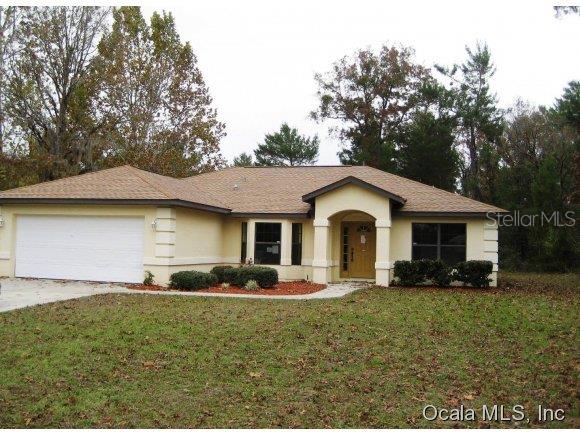 4365 Southwest 139th St Road Ocala, FL 34473 - Photo 1 of 1 a front view of house with yard and green space