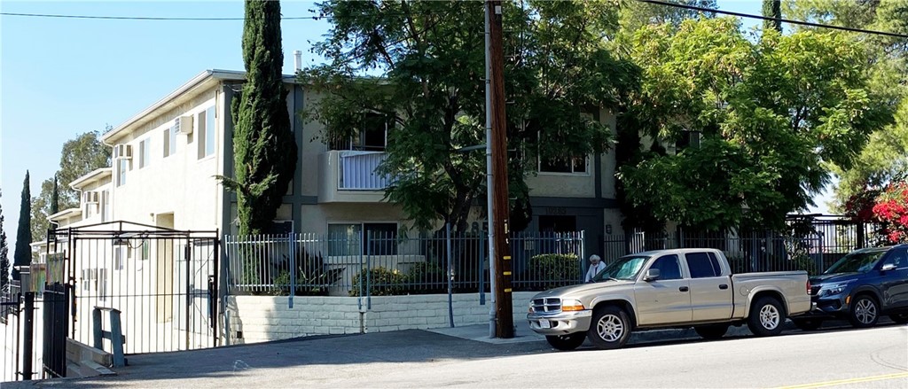 a front view of a house with parking area