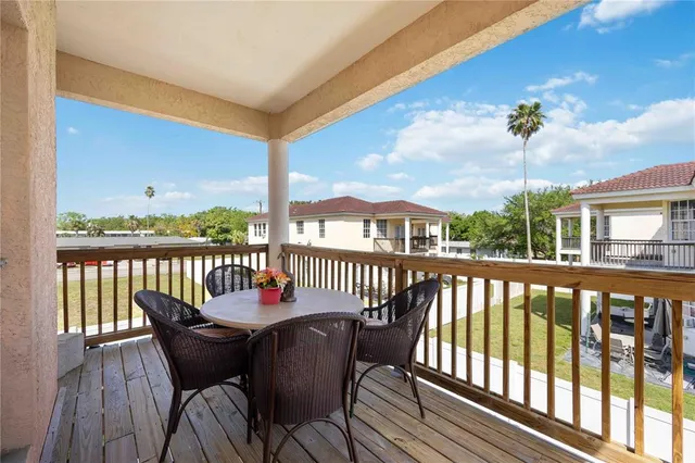 a swimming pool with outdoor seating and yard