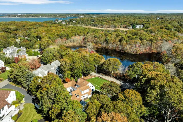 a bathroom with a sink and mirror with toilet
