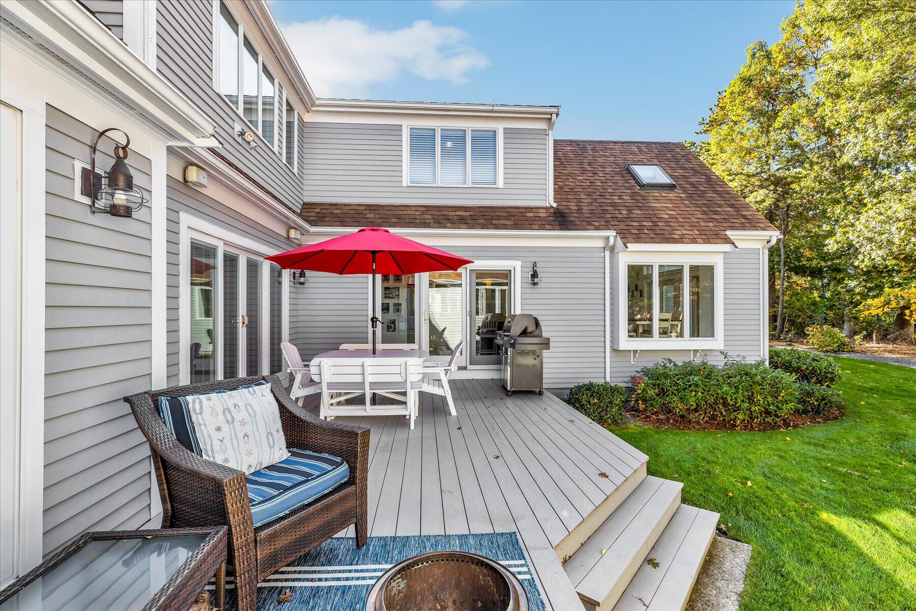 14 Ryder Road North Falmouth, MA 02556 - Photo 21 of 85 a view of a patio with a table and chairs