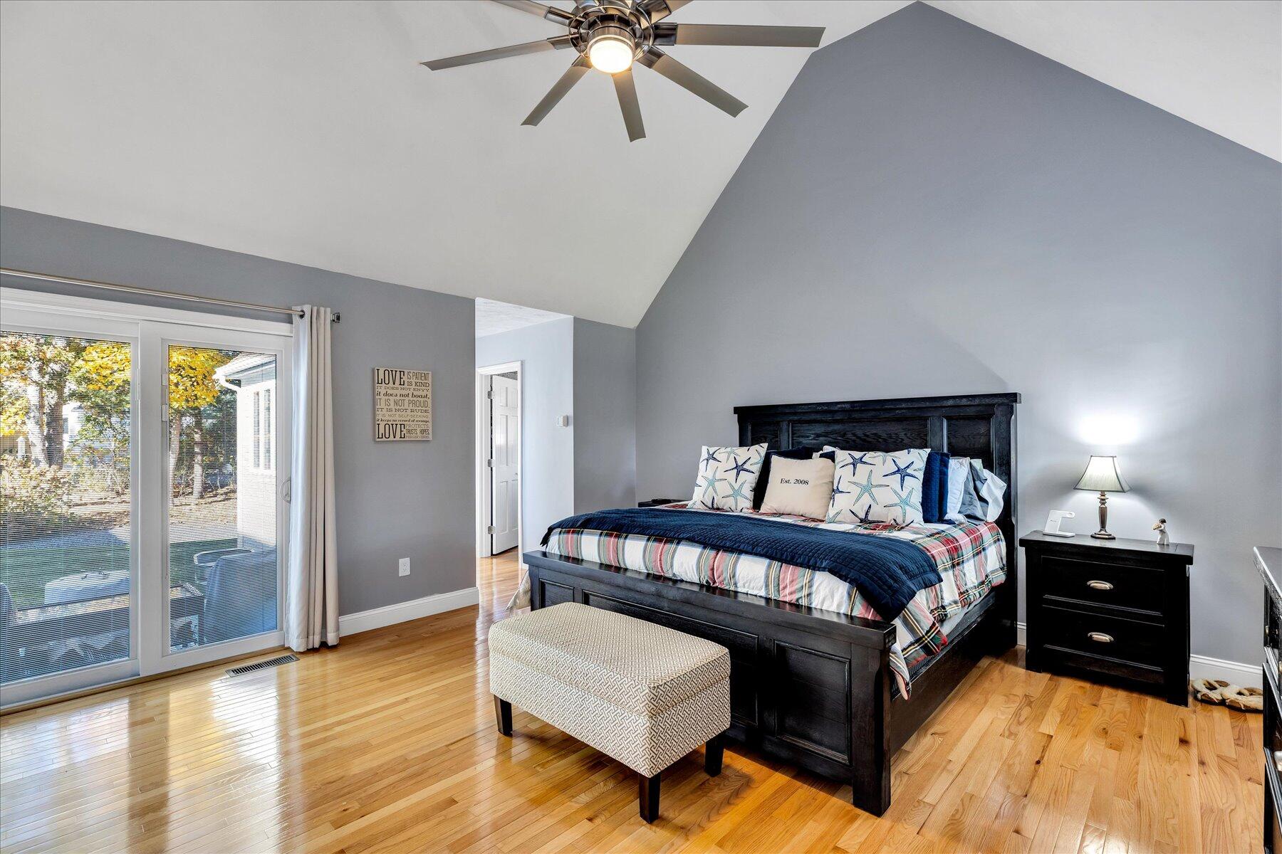 14 Ryder Road North Falmouth, MA 02556 - Photo 43 of 85 a bedroom with a bed and a night stand