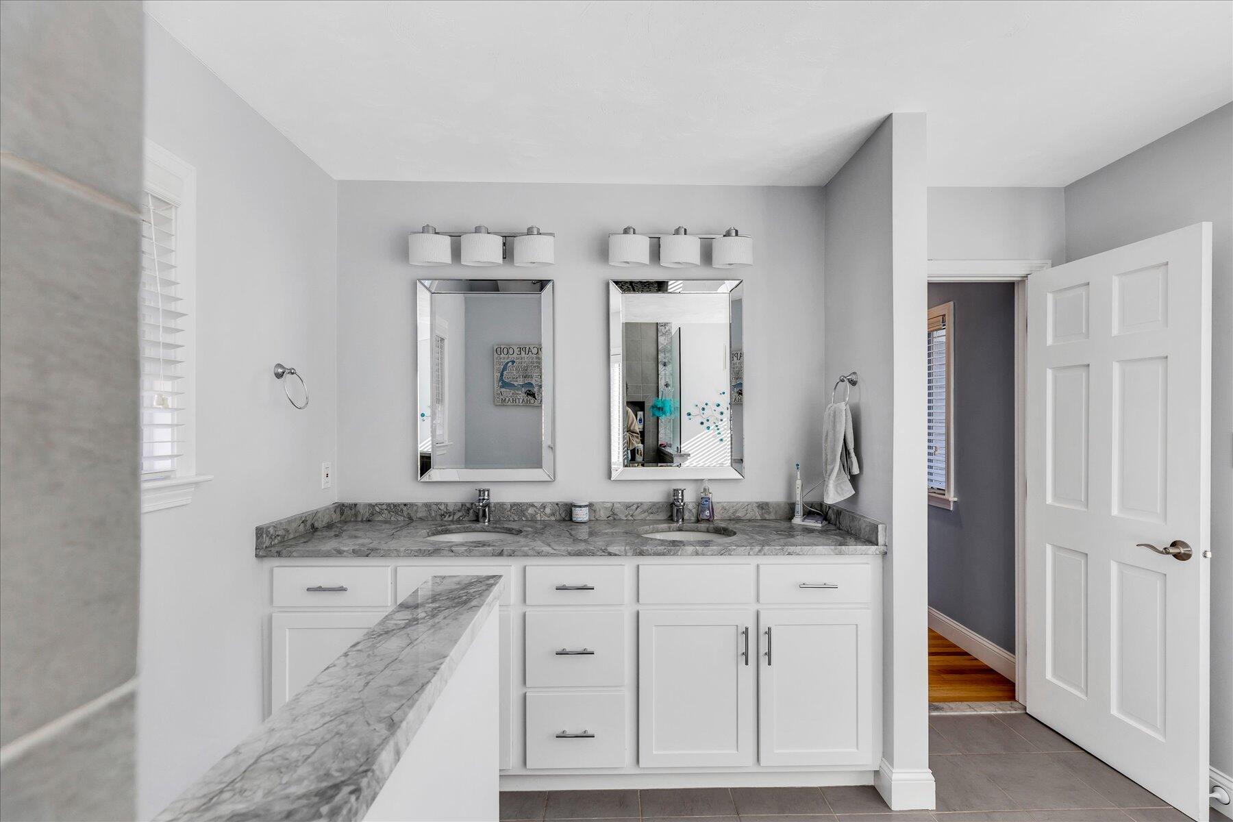 14 Ryder Road North Falmouth, MA 02556 - Photo 49 of 85 a bathroom with a granite countertop sink and a mirror