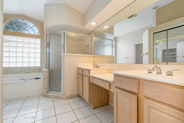 a bathroom with a granite countertop toilet a sink and a bathtub