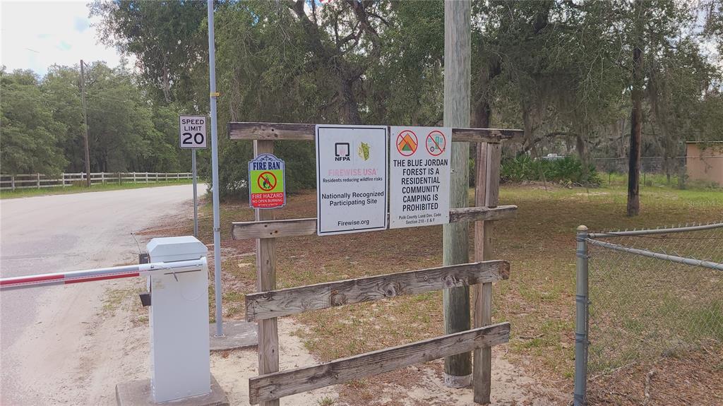 2575 North Bear Run Frostproof, FL 33843 - Photo 16 of 27 a sign on the side of a road