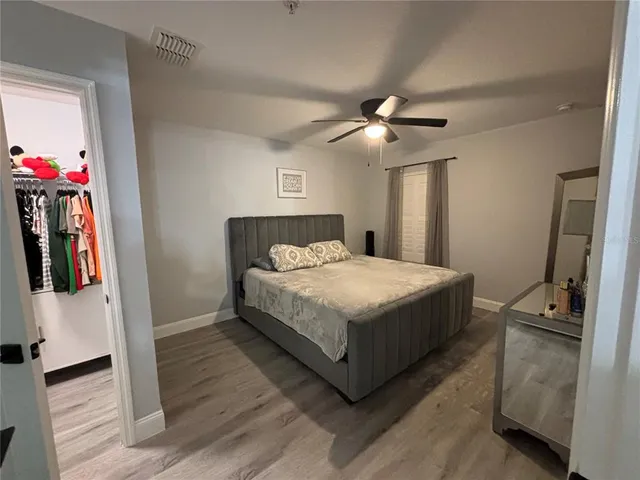 a large bed sitting in a bedroom and closet