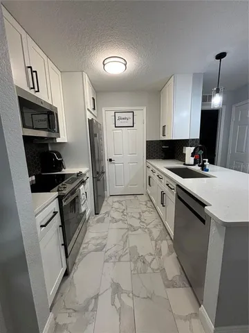 a bathroom with a sink and toilet