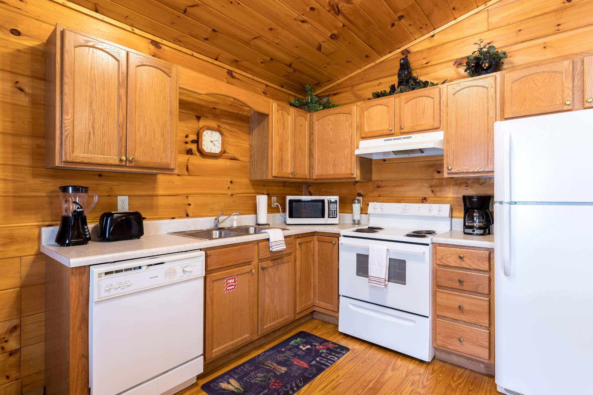 2036 Ridge Road, Unit 7 Sevierville, TN 37863 - Photo 11 of 23 a kitchen with a stove sink and cabinets